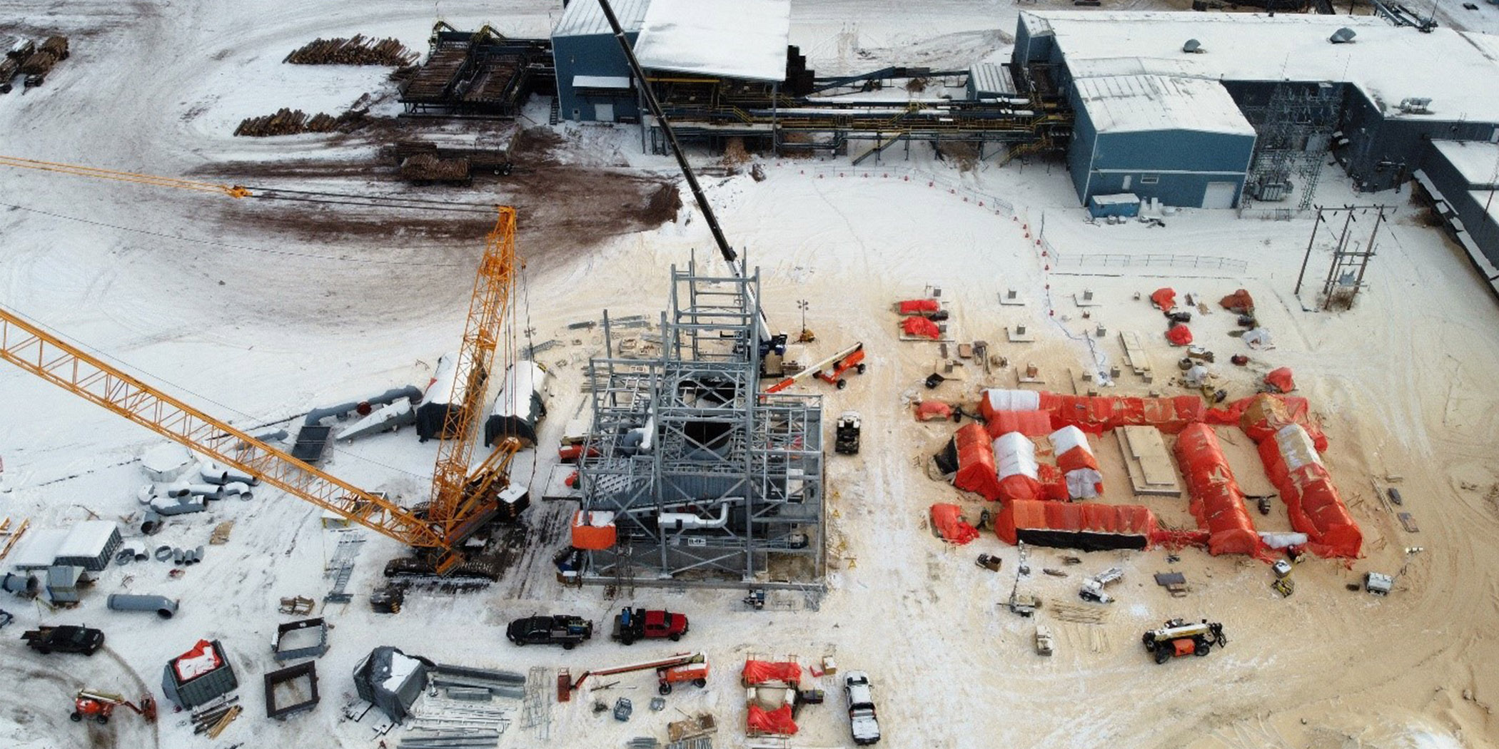 Crane setting up equipment in construction zone